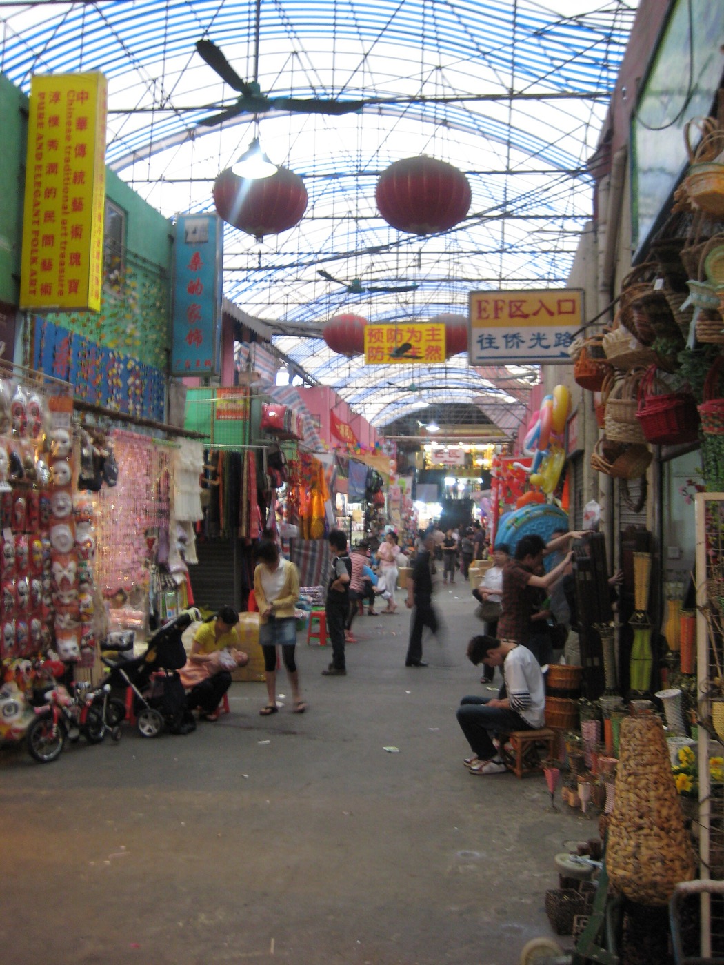 Inside Haizhu wholesale market in central Guangzhou, with fabric and goods stalls